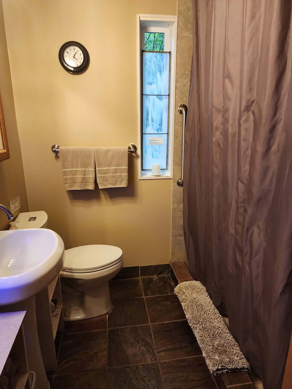 Clean bathroom with fresh towels hung